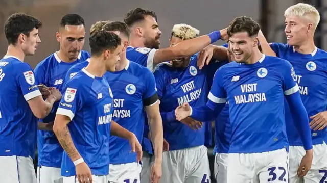 Cardiff players celebrate a goal against Portsmouth