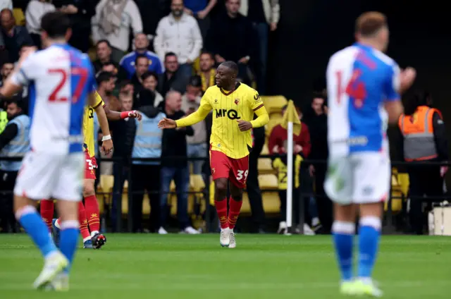 Watford's Edo Kayembe (centre) celebrates