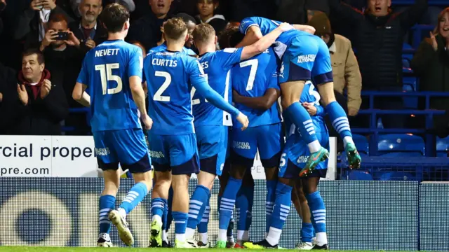 Peterborough celebrating Joel Randall's goal at Blackpool.