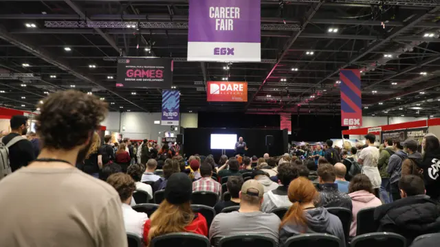 Dozens of attendees listen to a talk at the careers fair at EGX 2024