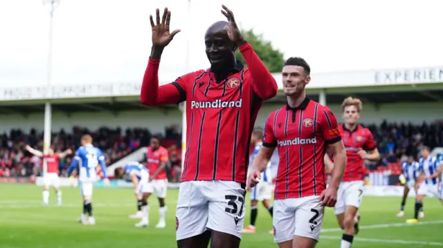 Walsall's Albert Adomah celebrating scoring a goal