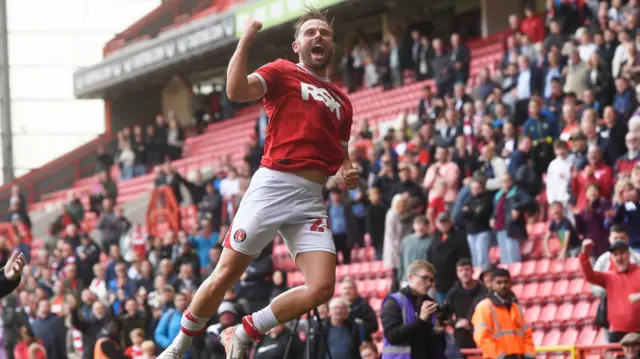 Charlton's Matty Godden jumps for joy after converting from the spot against Wrexham.