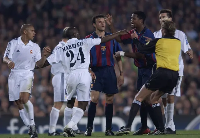 Patrick Kluivert of Barcelona fights with Claude Makelele of Real Madrid