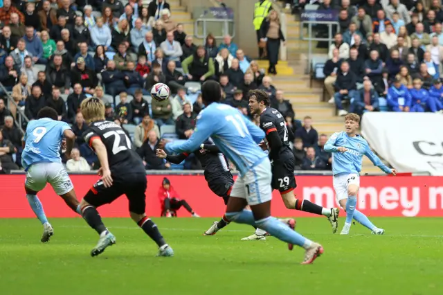 Coventry City's Victor Torp (right) scores