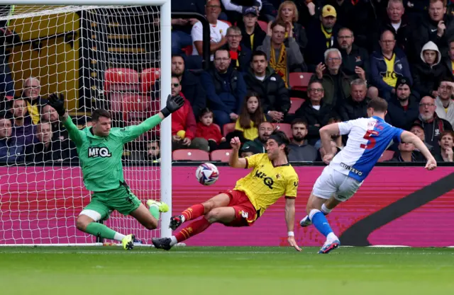 Blackburn Rovers' Dominic Hyam (right) has a shot at goal