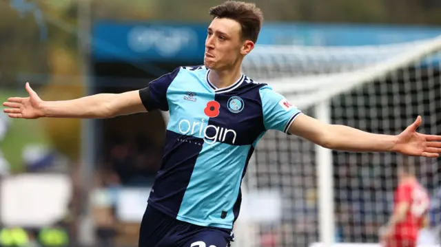 Cameron Humphreys celebrates scoring Wycombe's third against Leyton Orient.