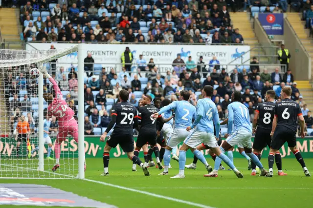 Coventry City's Ellis Simms (hidden) scores