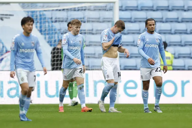 Coventry City's Josh Eccles (centre left), Ben Sheaf (centre right) and Joel Latibeaudiere (right) react after Luton Town's Elijah Adebayo scores their side's second goal of the game