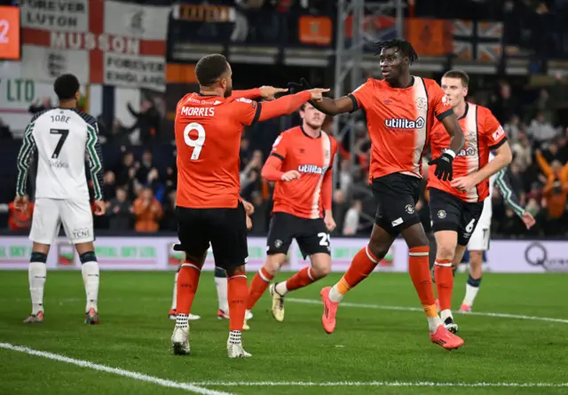 Carlton Morris and Elijah Adebayo celebrate after Adebayo scores for Luton