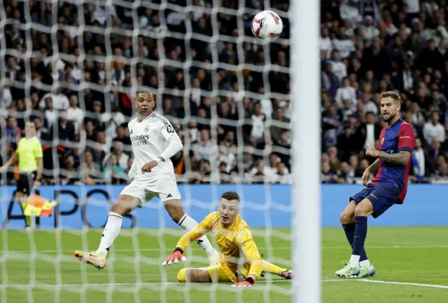 Mbappe dinks the ball over Pena to open the scoring for Madrid