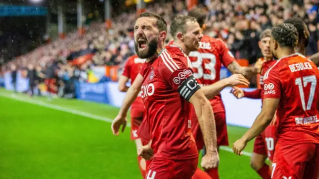 ABERDEEN, SCOTLAND - OCTOBER 26: Aberdeen's Graeme Shinnie celebrates after Peter Ambrose scores to make it 1-0 during a William Hill Premiership match between Aberdeen and Dundee United at Pittodrie Stadium, on October 26, 2024, in Aberdeen, Scotland. (Photo by Craig Williamson / SNS Group)