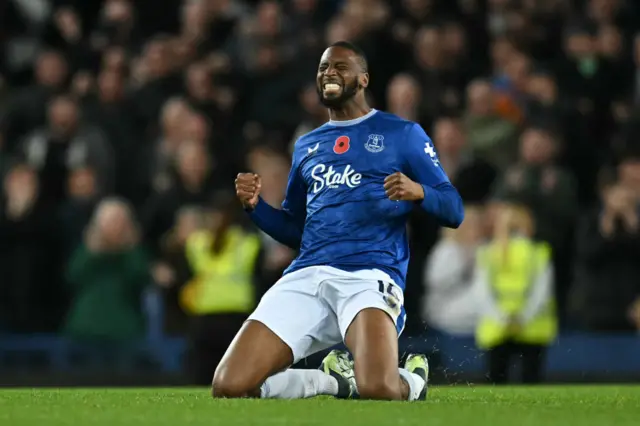 Beto falls to his knees as he celebrates his goal