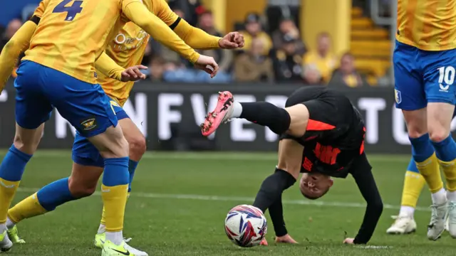 Birmingham's Jay Stansfield takes a tumble against Mansfield