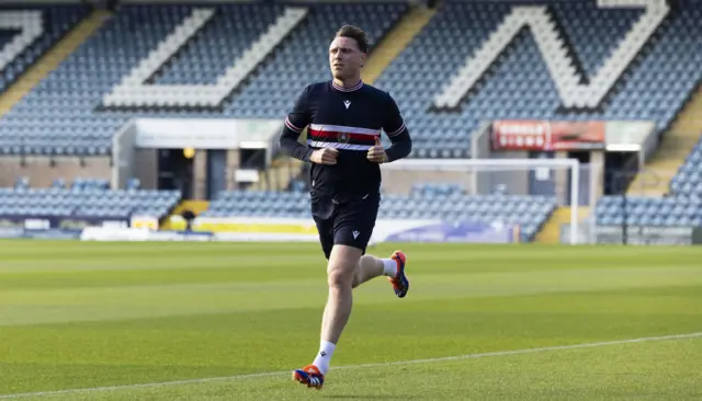 Dundee's Jordan McGhee warming up