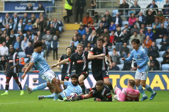 Coventry City's Milan van Ewijk (left) attempts a shot on goal