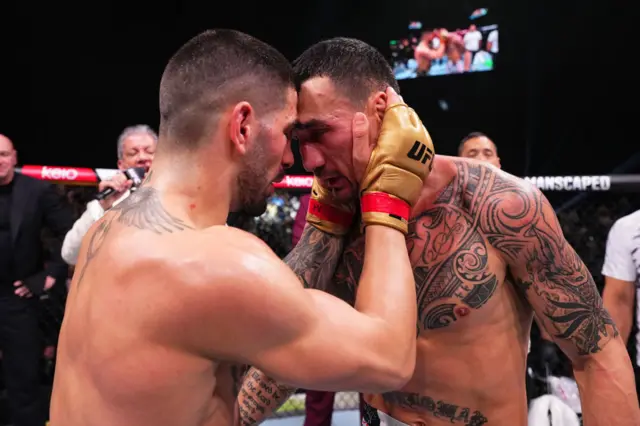 Ilia Topuria embraces Max Holloway