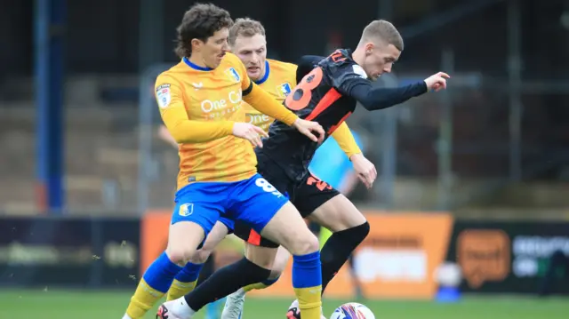 Birmingham's Jay Stansfield takes on the Mansfield defence.