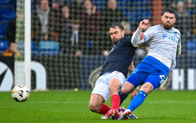 Ross County's Connor Randall and Kilmarnock's Liam Donnelly contest possession