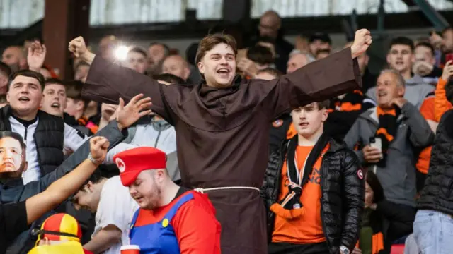 ABERDEEN, SCOTLAND - OCTOBER 26: A Dundee United fan dresses up as a monk during a William Hill Premiership match between Aberdeen and Dundee United at Pittodrie Stadium, on October 26, 2024, in Aberdeen, Scotland. (Photo by Craig Williamson / SNS Group)