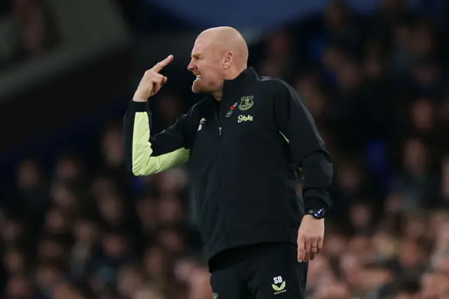 Dyche points angrily at something from the touchline