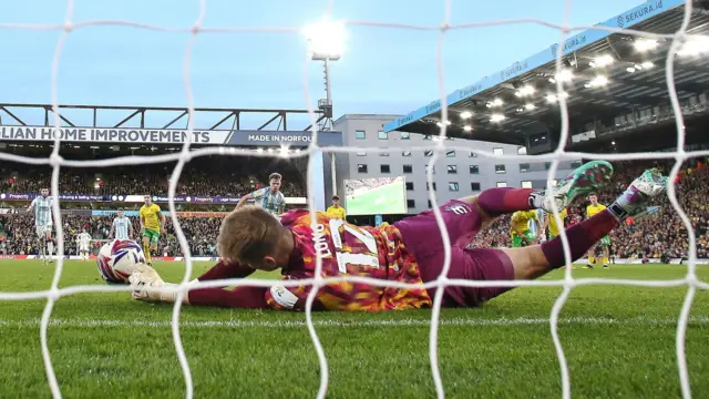 George Long saves a penalty