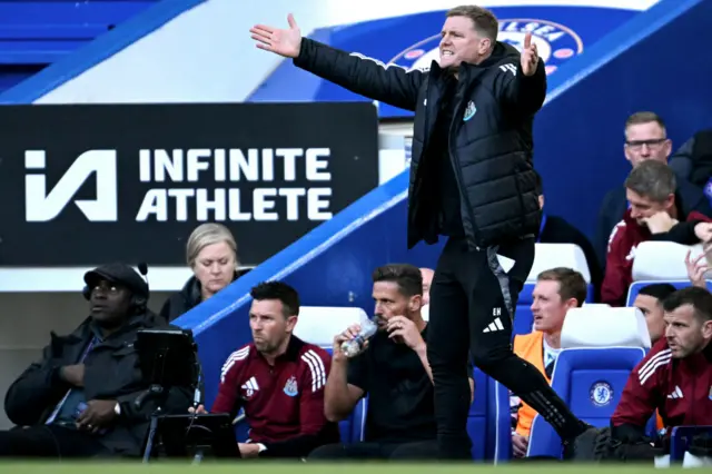 Howe waves his arms on the touchline