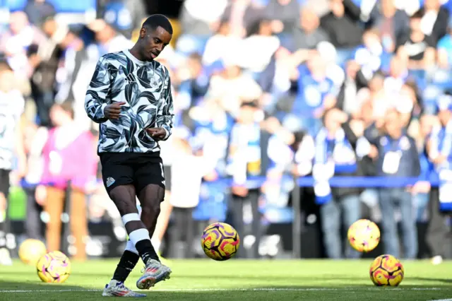 Isak does a training drill before kick off