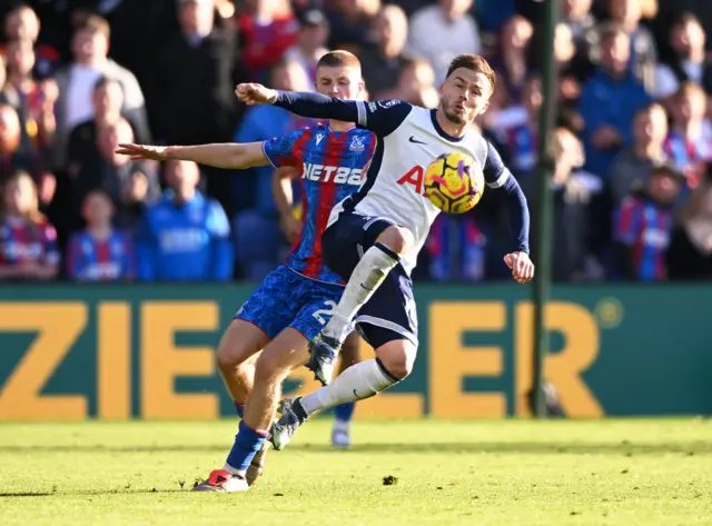 Maddison tries to dribble away from Wharton