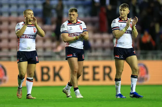 Mikey Lewis, Morgan Knowles and Harry Newman of England applaud the fan