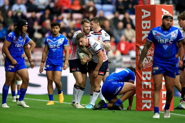 George Williams of England celebrates with teammates Daryl Clark