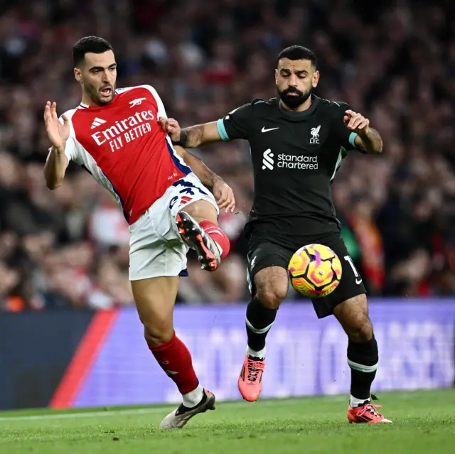 Merino and Salah battle for the ball