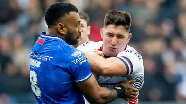 Samoa's Francis Molo tackles England's Victor Radley.