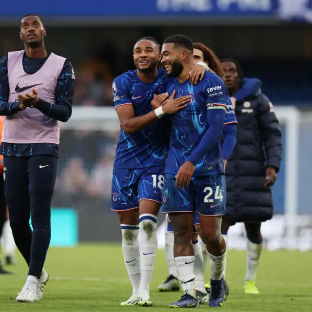 Chelsea players celebrate at full time