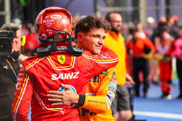 Lando Norris hugs Carlos Sainz