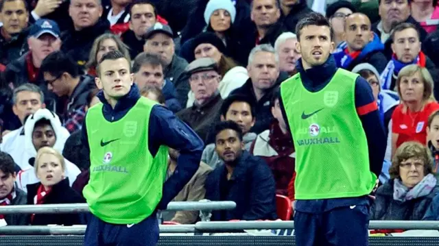 Jack Wilshere and Michael Carrick warm up for England