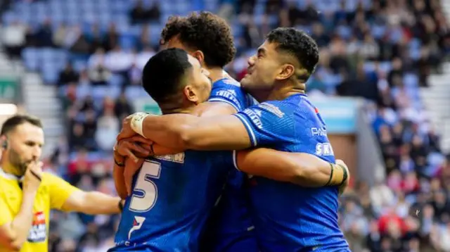 Samoa's Dean Mariner scores a try against England.