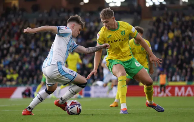 Ben Doak of Middlesbrough takes on Callum Doyle of Norwich City