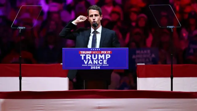 US comedian Tony Hinchcliffe speaks during a campaign rally for former US president and Republican presidential candidate Donald Trump