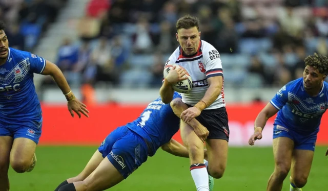 George Williams is tacked by Samoa's Roger Tulvasa-Sheck