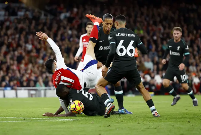 Konate and Martinelli collide in the box