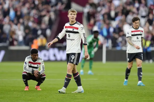 United players stand stunned at full time