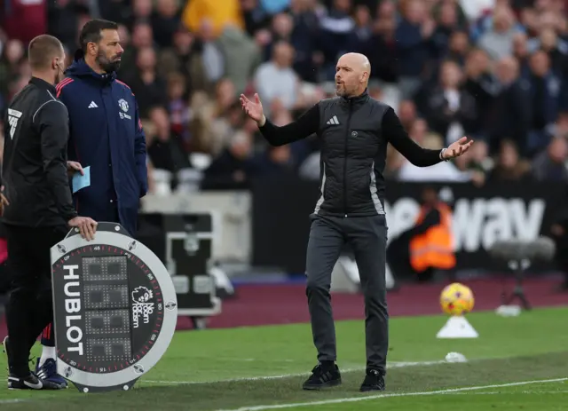 Ten Hag holds his hands in the air