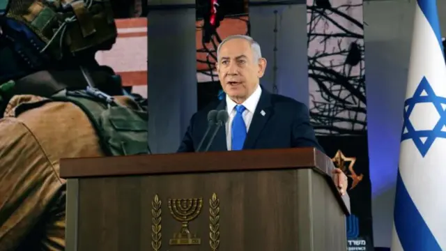 Israeli PM Benjamin Netanyahu addresses the audience at a ceremony to mark the 7 October attack