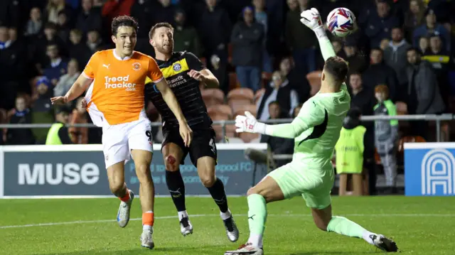 Kyle Joseph is denied by Wigan goalkeeper Sam Tickle.