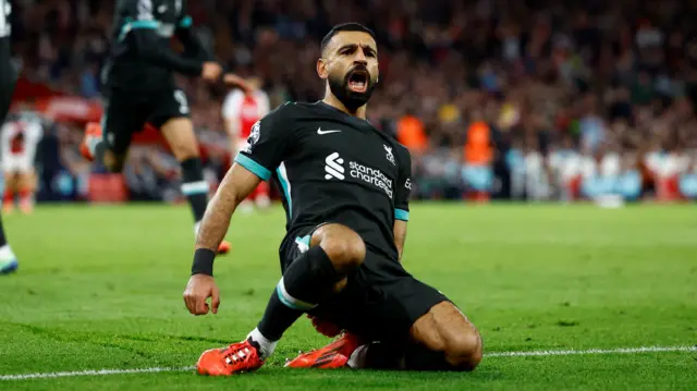 Mohamed Salah celebrates scoring for Liverpool at Arsenal