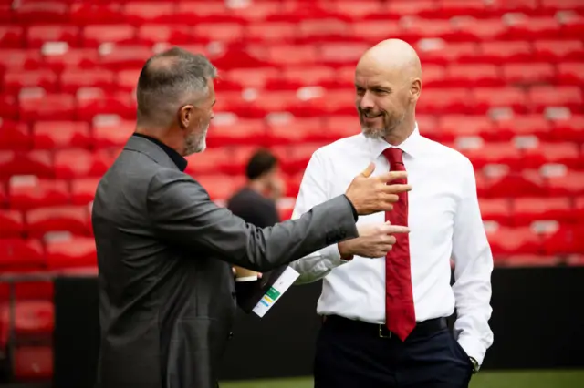 Erik ten Hag and Roy Keane chatting