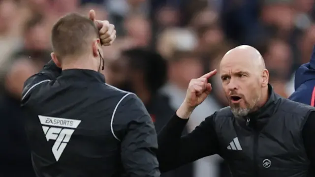 Erik ten Hag jesticulates to the fourth official during Manchester United's defeat at West Ham