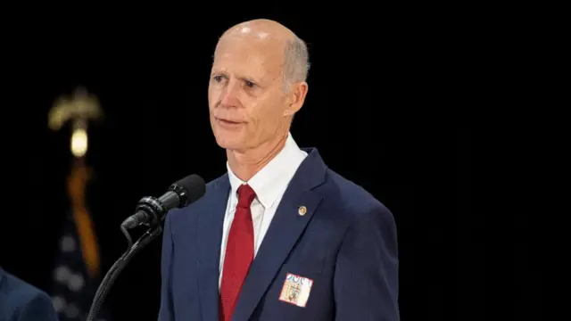 A file photo of Republican senator Rick Scott addressing an event from a podium