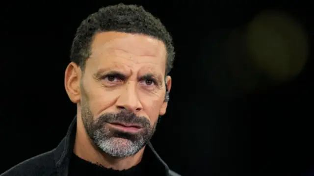 Rio Ferdinand on the pitch as a pundit for the Champions League match between Aston Villa and Bayern Munich