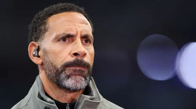 Rio Ferdinand pitchside as a pundit for the Champions League game between Aston Villa and Bologna